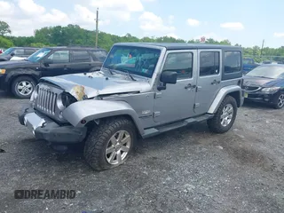 2014 Jeep Wrangler Unlimited Sahara z VIN 1C4BJWEG0EL129229, wystawiony jako IAAI lot #42380976 z przebiegiem 175 735 mil mil oraz . Historia ofert i sprzedaży dostępna na DreamBid. Obrazek 17.