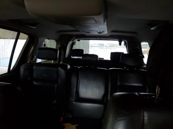 2006 Infiniti QX56 z VIN 5N3AA08A96N800292, wystawiony jako Copart lot #42050855 z przebiegiem 305 926 mil mil oraz Czysty tytuł • Clean title. Historia ofert i sprzedaży dostępna na DreamBid. Obrazek 10.