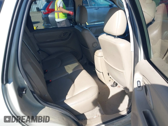2005 Mazda Tribute S with VIN 4F2CZ96105KM04032, listed as a IAAI auction lot 42157429 with 199,704 mi miles and . Bid and sale history available at carsss.com. Image 8.