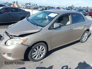 2009 Toyota Corolla with VIN 1NXBU40E29Z085053, listed as a IAAI auction lot 41966832 with 182,941 mi miles. Bid and sale history available at carsss.com. Image 2.