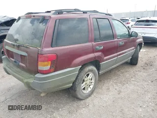 2003 Jeep Grand Cherokee Laredo with VIN 1J4GX48S83C576892, listed as a IAAI auction lot 42082865 with 212,157 mi miles. Bid and sale history available at carsss.com. Image 4.