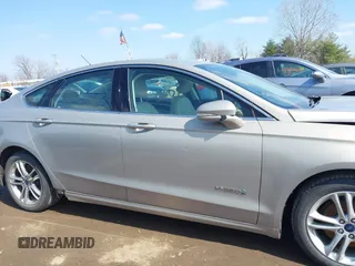 2016 Ford Fusion Titanium Hybrid with VIN 3FA6P0RU5GR171287, listed as a IAAI auction lot 41918195 with 74,721 mi miles. Bid and sale history available at carsss.com. Image 13.