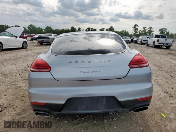 2014 Porsche Panamera с VIN WP0AA2A79EL009620, выставлен на аукционе Copart как лот 58654975 с пробегом 169 322 миль миль и Списание • Salvage title. История ставок и продаж доступна на DreamBid. Изображение 6.