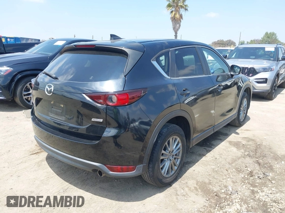2017 Mazda CX-5 Touring with VIN JM3KFACL0H0124632, listed as a IAAI auction lot 42134971 with 107,029 mi miles and . Bid and sale history available at carsss.com. Image 4.