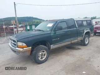 1999 Dodge Dakota SLT z VIN 1B7GG22X0XS104969, wystawiony jako IAAI lot #42493470 z przebiegiem 160 019 mil mil oraz . Historia ofert i sprzedaży dostępna na DreamBid. Obrazek 2.
