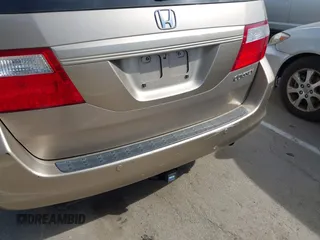 2005 Honda Odyssey EX-L z VIN 5FNRL38615B407908, wystawiony jako IAAI lot #42076045 z przebiegiem 170 950 mil mil oraz . Historia ofert i sprzedaży dostępna na DreamBid. Obrazek 14.