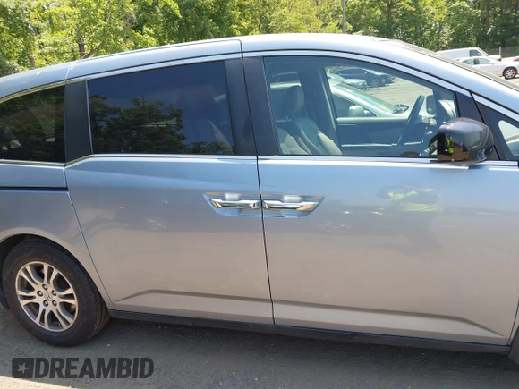 2011 Honda Odyssey EX-L with VIN 5FNRL5H60BB051135, listed as a IAAI auction lot 42588994 with 195,112 mi miles and . Bid and sale history available at DreamBid. Image 13.