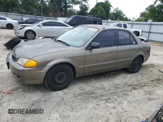 2000 Mazda Protege DX z VIN JM1BJ2223Y0244625, wystawiony jako Copart lot #60671175 z przebiegiem 201 033 mil mil oraz Szkoda całkowita • Salvage title. Historia ofert i sprzedaży dostępna na DreamBid. Obrazek 1.