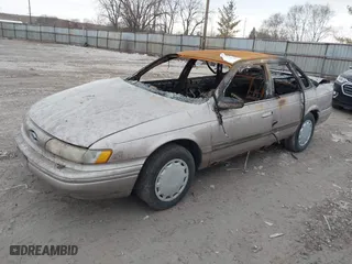 1994 Ford Taurus GL with VIN 1FALP52U6RA258445, listed as a IAAI auction lot 41512672 with 1 mi miles. Bid and sale history available at carsss.com. Image 2.
