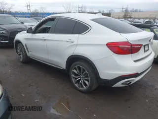 2015 BMW X6 xDrive35i with VIN 5UXKU2C57F0N77194, listed as a IAAI auction lot 41818860 with 105,579 mi miles and . Bid and sale history available at DreamBid. Image 3.