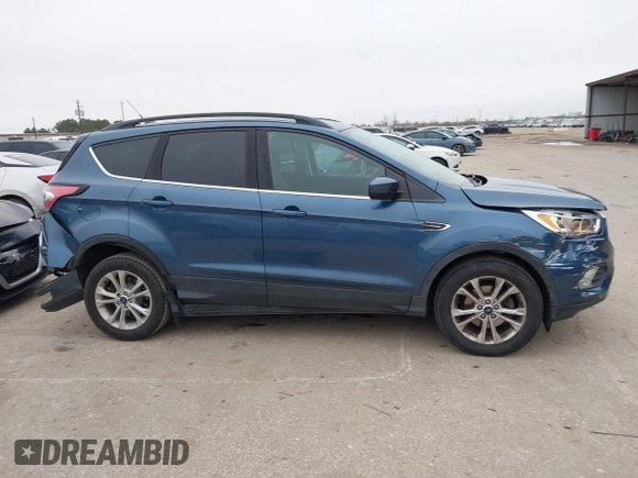 2018 Ford Escape SE with VIN 1FMCU0GD0JUC58115, listed as a IAAI auction lot 41578309 with 76,162 mi miles. Bid and sale history available at carsss.com. Image 13.