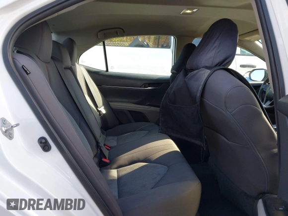 2020 Toyota Camry LE with VIN 4T1C11AKXLU986310, listed as a IAAI auction lot 40977100 with 108,208 mi miles and . Bid and sale history available at DreamBid. Image 8.