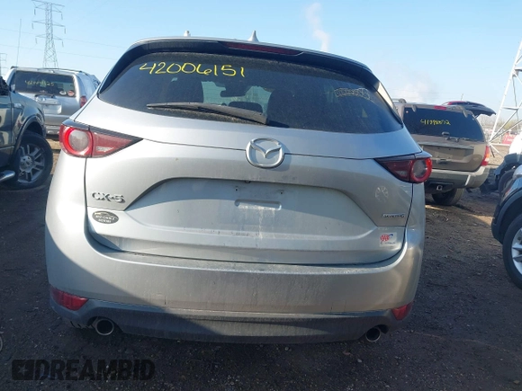 2020 Mazda CX-5 Touring with VIN JM3KFACM5L0766698, listed as a IAAI auction lot 42006157 with 80,288 mi miles and . Bid and sale history available at carsss.com. Image 16.