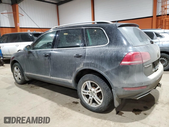 2013 Volkswagen Touareg Sport с VIN WVGEP9BP5DD008301, выставлен на аукционе Copart как лот 85085984 с пробегом 204 735 миль миль и Списание • Salvage title. История ставок и продаж доступна на DreamBid. Изображение 2.