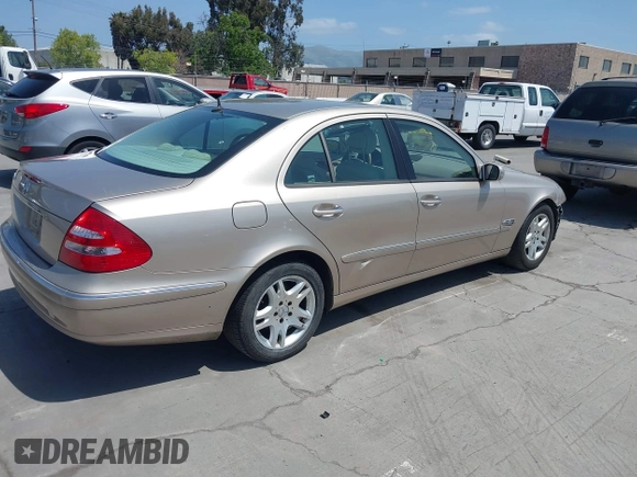 2003 Mercedes-Benz E-Class 3.2L with VIN WDBUF65JX3A236768, listed as a IAAI auction lot 42094824 with 251,896 mi miles. Bid and sale history available at carsss.com. Image 4.