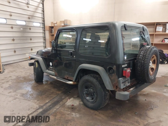 2003 Jeep Wrangler Sport Right Hand Drive with VIN 1J4F449S63P359031, listed as a IAAI auction lot 41495087 with 126,678 mi miles. Bid and sale history available at carsss.com. Image 3.