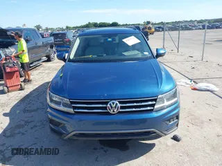 2018 Volkswagen Tiguan SEL z VIN 3VV3B7AX2JM155306, wystawiony jako IAAI lot #42457735 z przebiegiem 48 061 mil mil oraz . Historia ofert i sprzedaży dostępna na DreamBid. Obrazek 12.