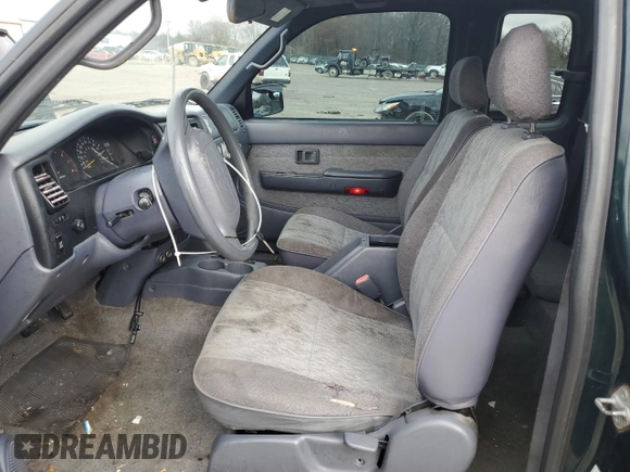 1999 Toyota Tacoma PreRunner z VIN 4TASM92N5XZ417982, wystawiony jako Copart lot #85216054 z przebiegiem 200 772 mil mil oraz Szkoda całkowita • Salvage title. Historia ofert i sprzedaży dostępna na DreamBid. Obrazek 7.
