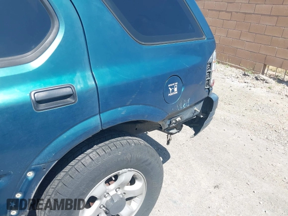 1998 Isuzu Rodeo S z VIN 4S2CM58W8W4328196, wystawiony jako IAAI lot #42323556 z przebiegiem 272 915 mil mil oraz . Historia ofert i sprzedaży dostępna na DreamBid. Obrazek 12.