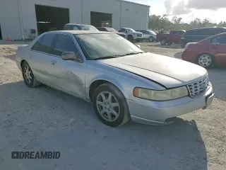 2003 Cadillac Seville Touring STS z VIN 1G6KY54923U101998, wystawiony jako Copart lot #74029304 z przebiegiem 134 157 mil mil oraz Szkoda całkowita • Salvage title. Historia ofert i sprzedaży dostępna na DreamBid. Obrazek 10.