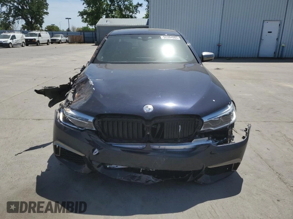 2019 BMW 5 Series M550i xDrive with VIN WBAJB9C5XKB287877, listed as a Copart auction lot 52994065 with 52,460 mi miles and Salvage title. Bid and sale history available at DreamBid. Image 5.