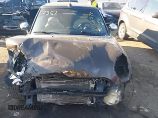 2011 MINI Convertible with VIN WMWZN3C55BT133367, listed as a IAAI auction lot 41781374 with 124,036 mi miles and . Bid and sale history available at DreamBid. Image 12.