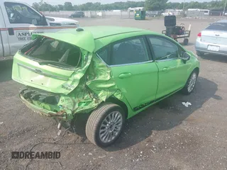 2014 Ford Fiesta Titanium z VIN 3FADP4FJXEM226724, wystawiony jako IAAI lot #42427106 z przebiegiem 63 302 mil mil oraz . Historia ofert i sprzedaży dostępna na DreamBid. Obrazek 4.