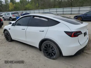 2021 Tesla Model Y Standard Range z VIN 5YJYGDED1MF109091, wystawiony jako Copart lot #50414004 z przebiegiem Nie podano mil oraz Szkody całkowita. Historia ofert i sprzedaży dostępna na DreamBid. Obrazek 2.