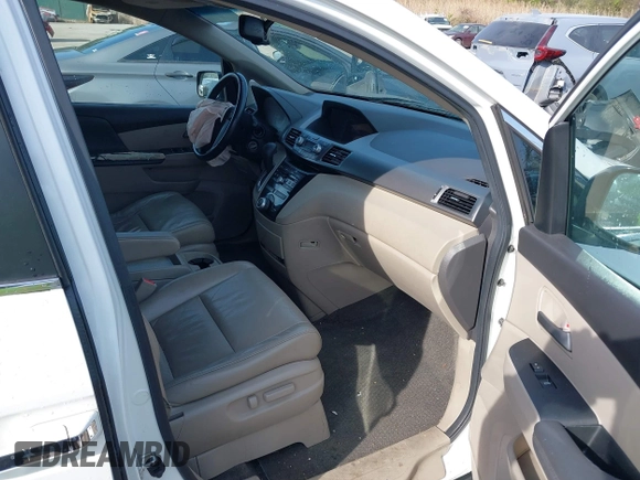 2011 Honda Odyssey EX-L with VIN 5FNRL5H6XBB059162, listed as a IAAI auction lot 42061378 with 164,317 mi miles and . Bid and sale history available at carsss.com. Image 5.