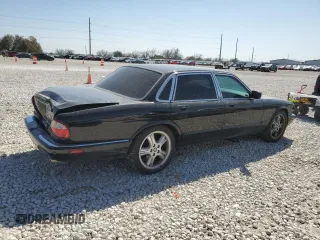 2002 Jaguar XJ with VIN SAJDA15BX2MF47193, listed as a Copart auction lot 49065275 with 69,544 mi miles and Salvage title. Bid and sale history available at DreamBid. Image 3.