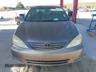2004 Toyota Camry LE with VIN 4T1BE32KX4U916477, listed as a IAAI auction lot 42018299 with 149,247 mi miles. Bid and sale history available at carsss.com. Image 6.