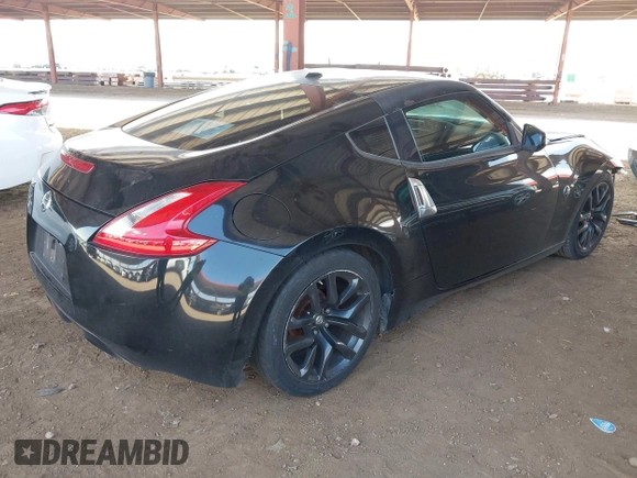 2015 Nissan 370Z Sport with VIN JN1AZ4EH3FM442775, listed as a IAAI auction lot 41960249 with 125,780 mi miles and . Bid and sale history available at DreamBid. Image 4.