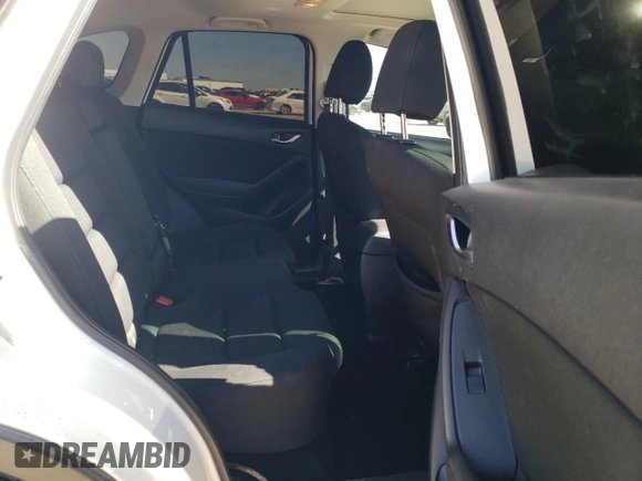 2016 Mazda CX-5 Touring with VIN JM3KE2CY7G0657113, listed as a Copart auction lot 46489835 with 166,399 mi miles and Salvage Title. Bid and sale history available at DreamBid. Image 11.