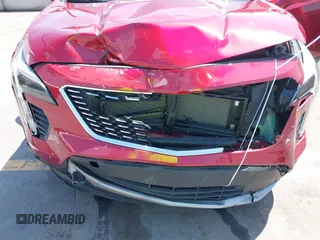 2021 Cadillac XT4 FWD Premium Luxury z VIN 1GYFZCR48MF004849, wystawiony jako IAAI lot #42131896 z przebiegiem 9 864 mil mil oraz . Historia ofert i sprzedaży dostępna na DreamBid. Obrazek 6.