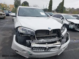 2018 BMW X5 xDrive40e iPerformance with VIN 5UXKT0C58J0V99415, listed as a IAAI auction lot 41391474 with 124,671 mi miles. Bid and sale history available at carsss.com. Image 13.