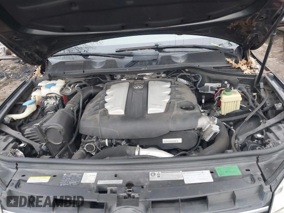 2012 Volkswagen Touareg Sport with VIN WVGFK9BP7CD002243, listed as a IAAI auction lot 41863765 with 136,231 mi miles and . Bid and sale history available at DreamBid. Image 10.