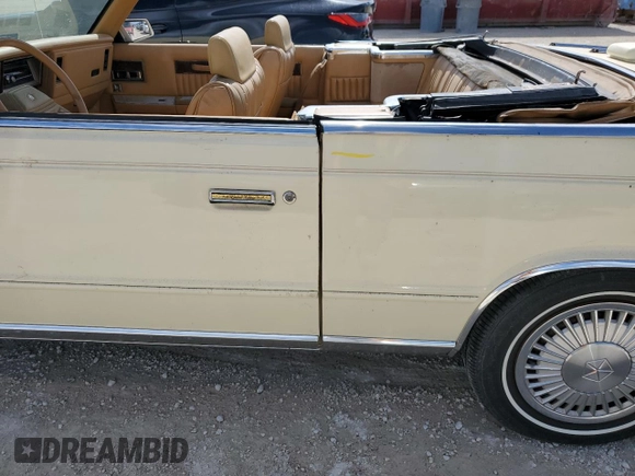 1986 Chrysler LeBaron z VIN 1C3BC55D0GG153072, wystawiony jako Copart lot #77865854 z przebiegiem 74 922 mil mil oraz Szkoda całkowita • Salvage title. Historia ofert i sprzedaży dostępna na DreamBid. Obrazek 12.