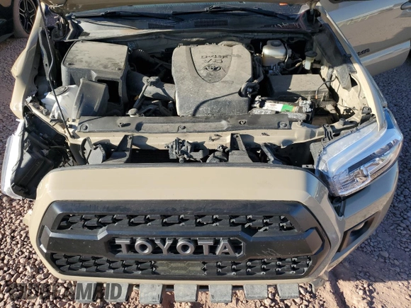 2019 Toyota Tacoma SR z VIN 5TFCZ5AN8KX171793, wystawiony jako Copart lot #57907015 z przebiegiem 96 925 mil mil oraz Szkoda całkowita • Salvage title. Historia ofert i sprzedaży dostępna na DreamBid. Obrazek 11.