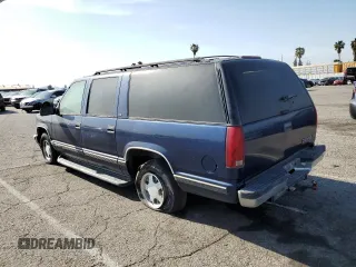 1999 Chevrolet Suburban with VIN 3GNEC16RXXG254126, listed as a Copart auction lot 52051405 with 113,554 mi miles and Clean title. Bid and sale history available at DreamBid. Image 2.