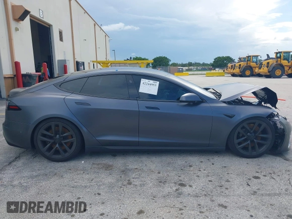 2023 Tesla Model S with VIN 5YJSA1E54PF501565, listed as a IAAI auction lot 42244953 with Not provided miles and . Bid and sale history available at DreamBid. Image 12.
