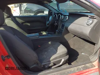 2005 Ford Mustang Deluxe z VIN 1ZVFT80N955155293, wystawiony jako IAAI lot #41891807 z przebiegiem 169 092 mil mil oraz . Historia ofert i sprzedaży dostępna na DreamBid. Obrazek 5.