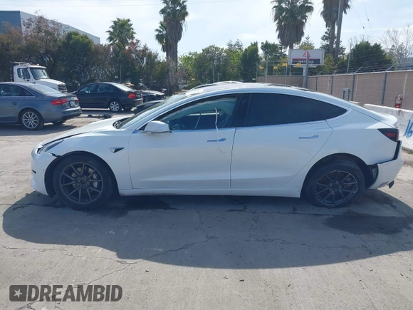 2018 Tesla Model 3 Long Range Battery with VIN 5YJ3E1EB7JF108519, listed as a IAAI auction lot 41835266 with 120,662 mi miles and . Bid and sale history available at DreamBid. Image 14.