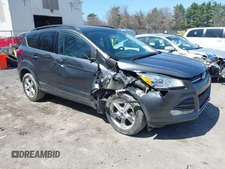 2016 Ford Escape SE z VIN 1FMCU9GX5GUC48686, wystawiony jako IAAI lot #42081996 z przebiegiem 84 652 mil mil oraz . Historia ofert i sprzedaży dostępna na DreamBid. Obrazek 1.
