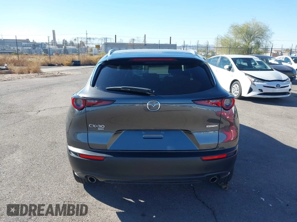 2022 Mazda CX-30 S Select z VIN 3MVDMBBL0NM415511, wystawiony jako IAAI lot #41513247 z przebiegiem Nie podano mil oraz . Historia ofert i sprzedaży dostępna na DreamBid. Obrazek 17.