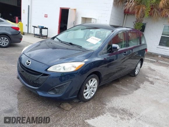 2014 Mazda 5 Sport with VIN JM1CW2BL6E0169672, listed as a IAAI auction lot 42422459 with 212,179 mi miles and . Bid and sale history available at DreamBid. Image 2.