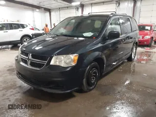 2014 Dodge Grand Caravan SXT with VIN 2C4RDGCGXER154709, listed as a IAAI auction lot 41117603 with 214,872 mi miles and . Bid and sale history available at DreamBid. Image 17.
