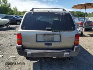1998 Jeep Grand Cherokee Laredo z VIN 1J4GZ58S4WC278490, wystawiony jako Copart lot #62388535 z przebiegiem 133 896 mil mil oraz Czysty tytuł • Clean title. Historia ofert i sprzedaży dostępna na DreamBid. Obrazek 6.