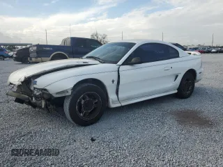 1997 Ford Mustang with VIN 1FALP4044VF174876, listed as a Copart auction lot 41601355 with 103,828 mi miles and Salvage Title. Bid and sale history available at carsss.com. Image 1.