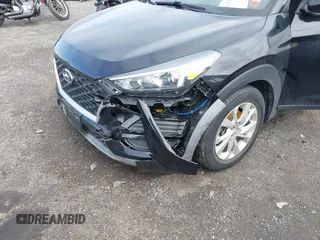 2019 Hyundai Tucson SE with VIN KM8J2CA46KU977863, listed as a IAAI auction lot 41704318 with 23,076 mi miles. Bid and sale history available at carsss.com. Image 18.