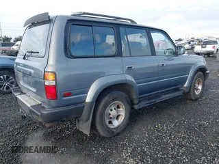 1995 Toyota Land Cruiser z VIN JT3DJ81W0S0094999, wystawiony jako IAAI lot #41583748 z przebiegiem 93 454 mil mil oraz . Historia ofert i sprzedaży dostępna na DreamBid. Obrazek 4.